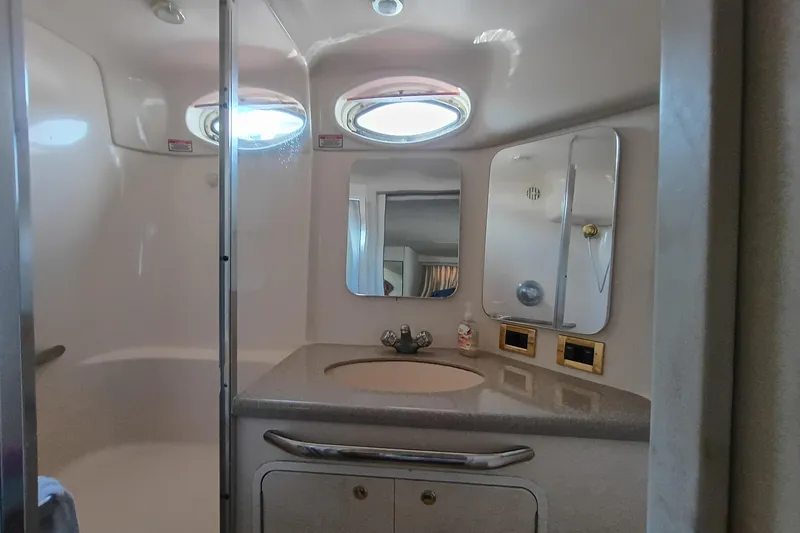 Slide: The Image of Bathroom interior of 1997 Sea Ray 370 Aft Cabin yacht with sink and mirrors. - 66