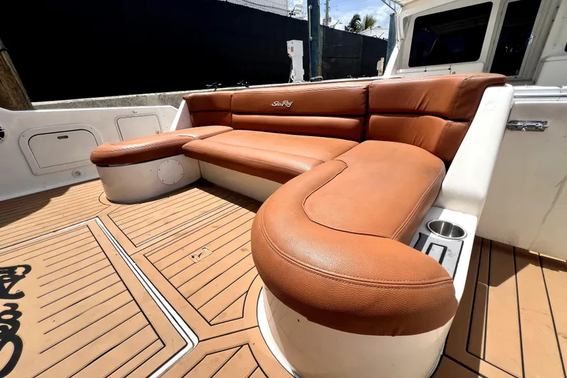 Slide: The Image of Luxurious seating on 1997 Sea Ray 450 Express Bridge yacht with brown leather upholstery. - 16