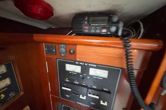Slide: The Image of Electrical panel and radio equipment on a 1996 Beneteau 50 sailboat. - 78