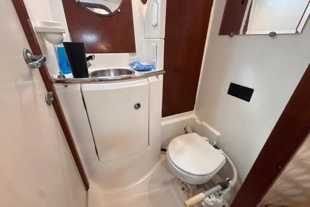Slide: The Image of Bathroom interior of a 1996 Beneteau 50 yacht, featuring sink and toilet. - 90
