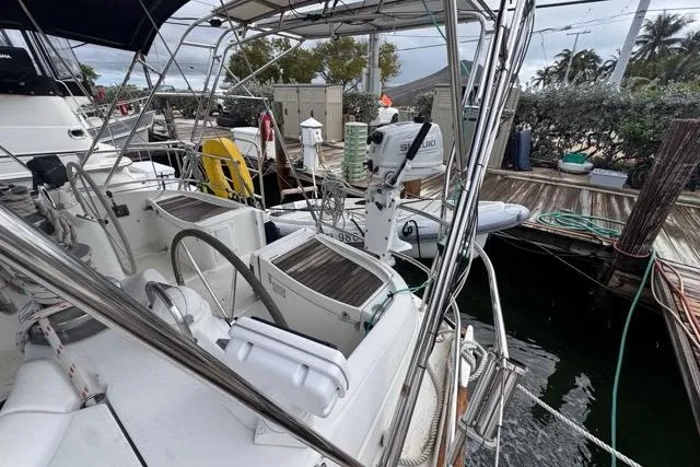 Slide: The Image of Cockpit view of a 1996 Beneteau 50 sailboat docked at a marina. - 10