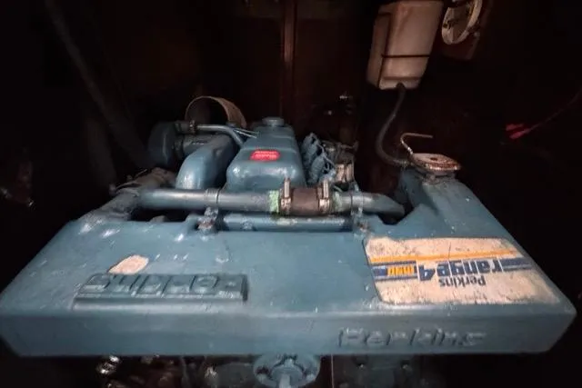 Slide: The Image of Engine of a 1996 Beneteau 50 sailboat, featuring a Perkins marine engine. - 109