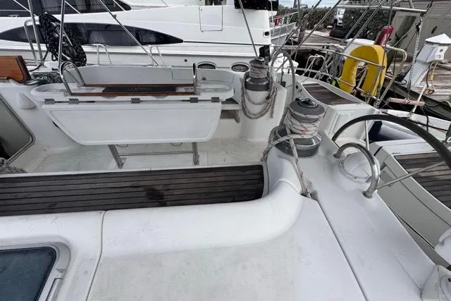 Slide: The Image of Cockpit view of a 1996 Beneteau 50 sailboat with winches and seating. - 11