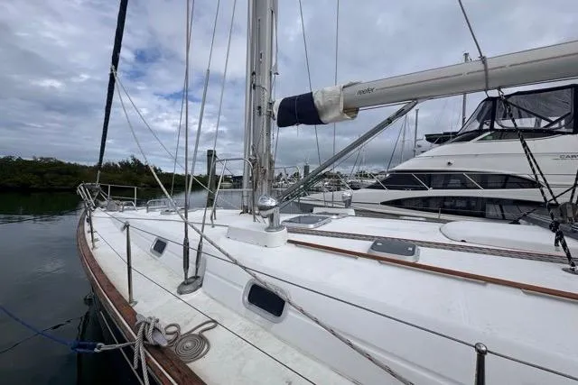 Slide: The Image of Sailing yacht Beneteau 50, 1996 model, docked with overcast sky. - 9