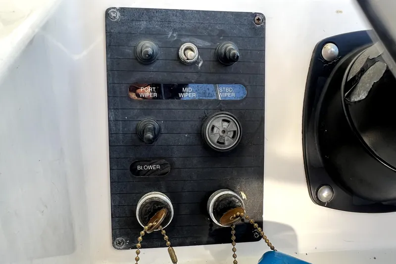 Slide: The Image of Control panel of a 1996 Wellcraft 330 Coastal boat with wiper and blower switches. - 47