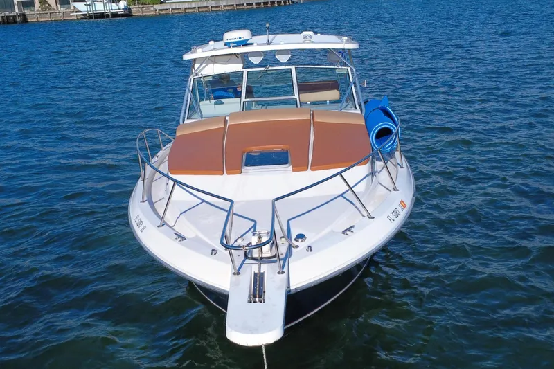 Slide: The Image of 1996 Wellcraft 330 Coastal boat on calm water. - 4