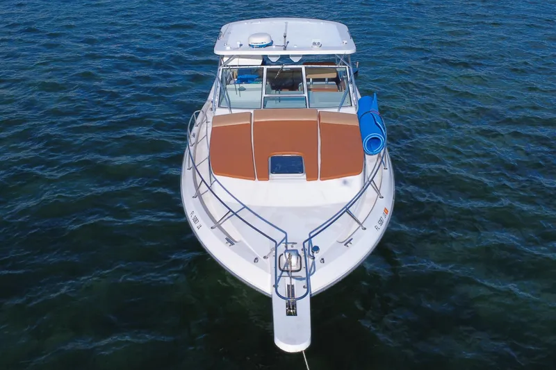 Slide: The Image of 1996 Wellcraft 330 Coastal boat on water, aerial view. - 19