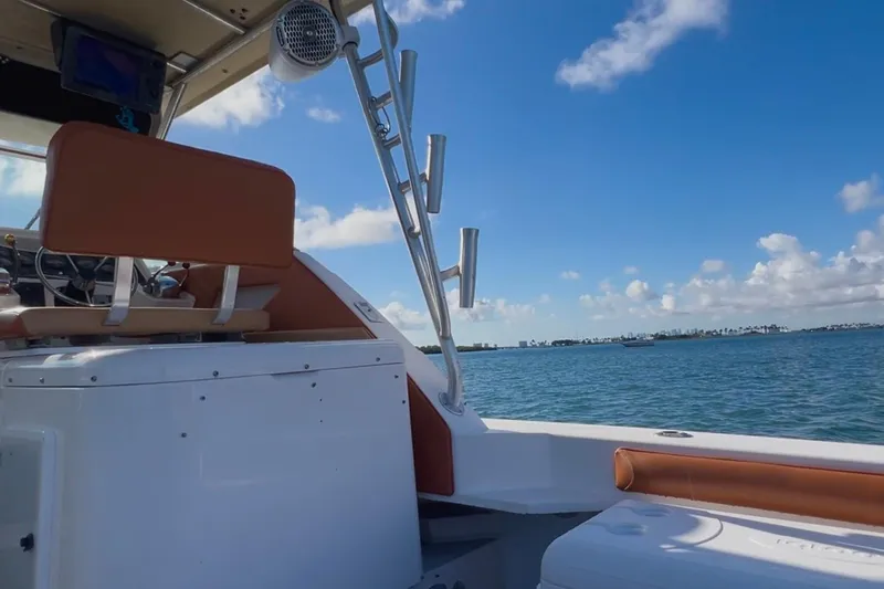 Slide: The Image of 1996 Wellcraft 330 Coastal boat interior with ocean view under clear blue sky. - 32