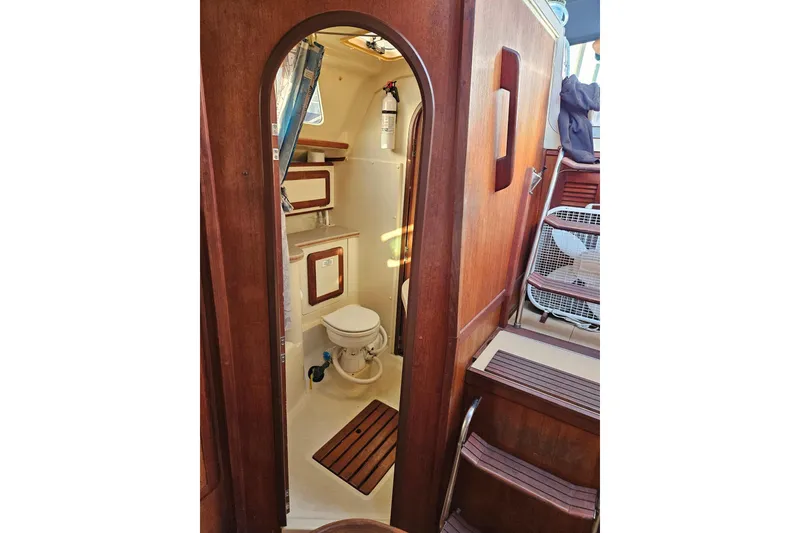 Slide: The Image of Interior view of 1993 Hunter Vision 36 sailboat bathroom with wooden accents. - 17