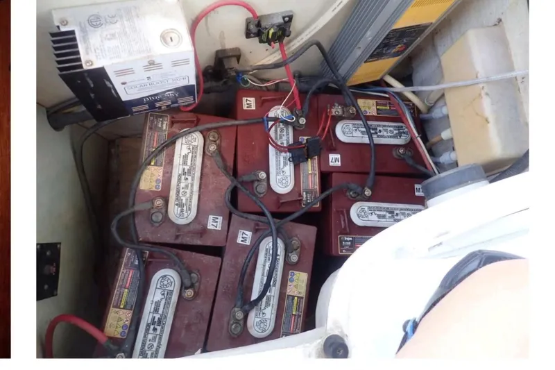 Slide: The Image of Battery compartment of a 1993 Hunter Vision 36 sailboat with multiple batteries and wiring. - 16