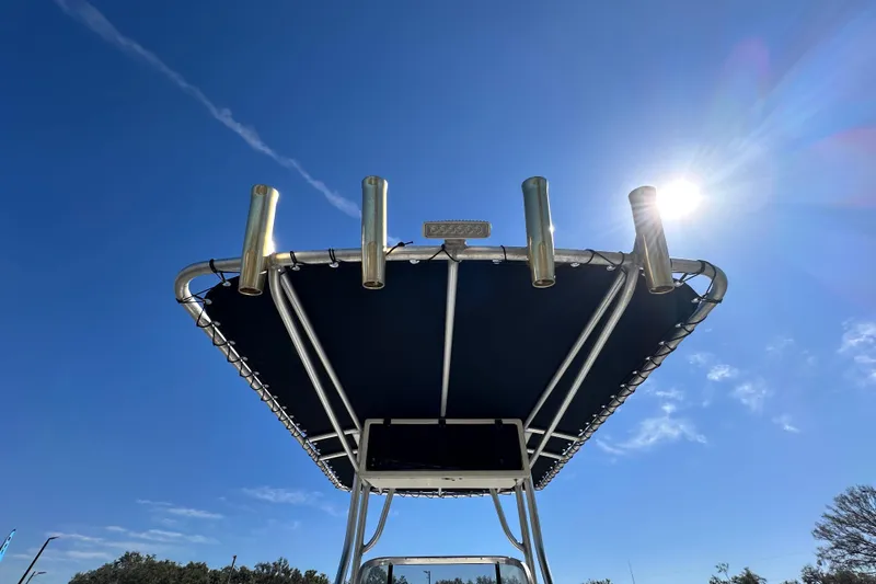 Slide: The Image of 1993 Hydra-Sports Bay Bolt 1900 boat canopy under clear blue sky. - 16