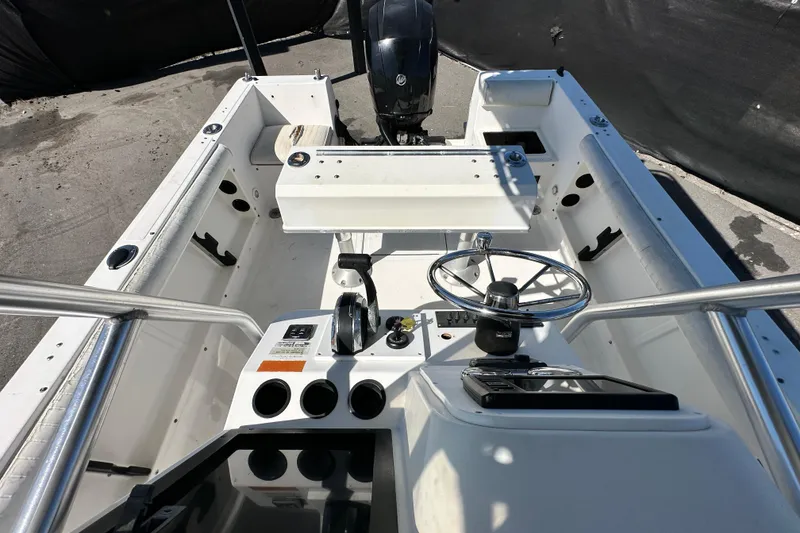 Slide: The Image of 1993 Hydra-Sports Bay Bolt 1900 boat interior with steering wheel and controls. - 54