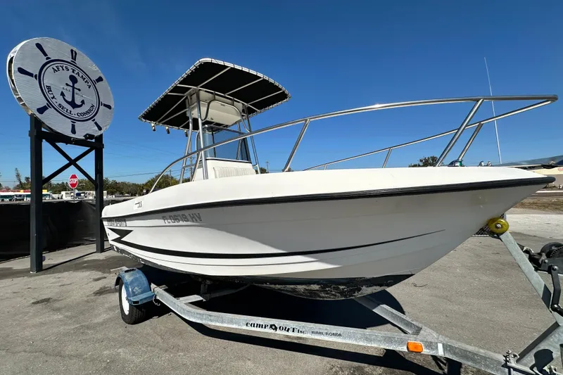 The Image of 1993 Hydra-Sports Bay Bolt 1900 boat on trailer, displayed outdoors under clear blue sky. - 0