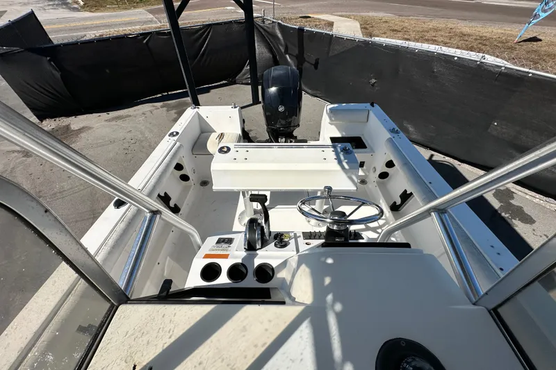 Slide: The Image of 1993 Hydra-Sports Bay Bolt 1900 boat interior with steering wheel and controls. - 53