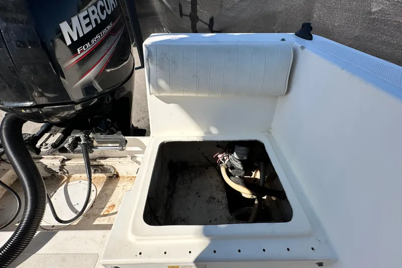 Slide: The Image of 1993 Hydra-Sports Bay Bolt 1900 boat with Mercury FourStroke engine, open storage compartment. - 61