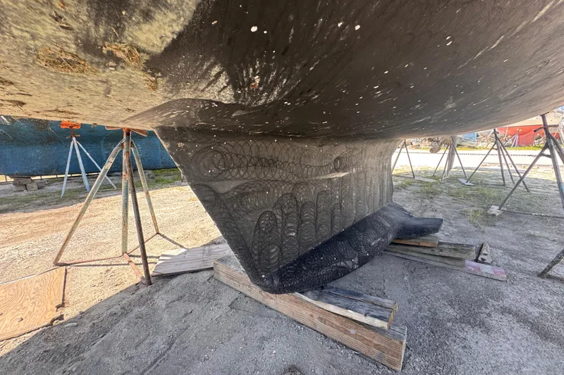 Slide: The Image of 1992 Hunter Passage 42 sailboat keel on stands, under maintenance. - 18