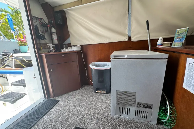 Slide: The Image of Interior of 1991 Ocean Yachts 35 Super Sport with freezer and storage cabinet. - 65