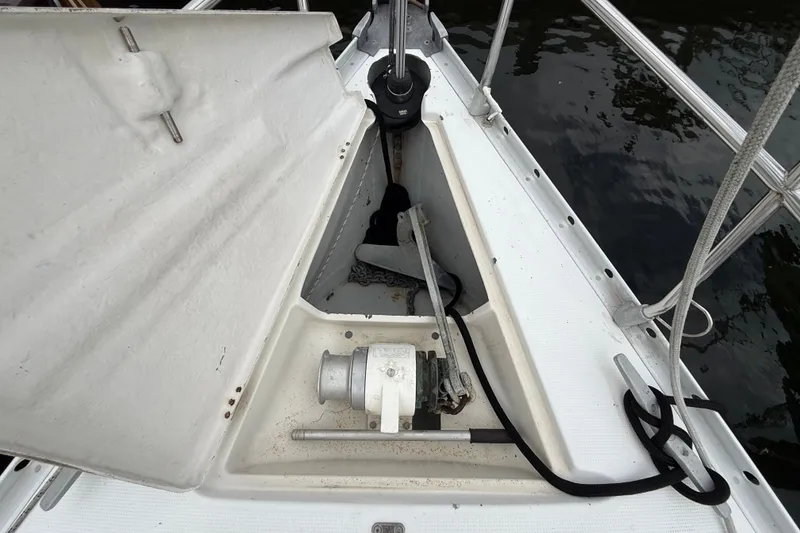 Slide: The Image of Anchor locker of a 1990 Beneteau First 35s5 sailboat with winch and ropes. - 33
