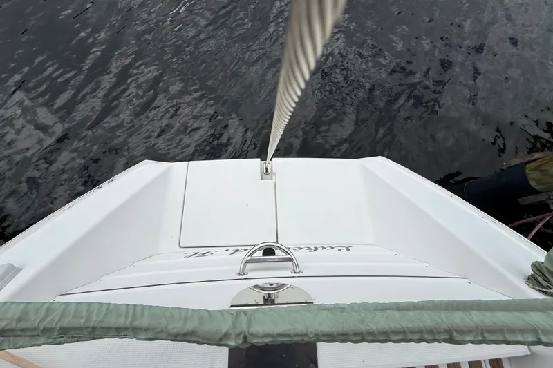 Slide: The Image of Beneteau First 35s5 sailboat stern view, 1990 model, docked on calm water. - 51