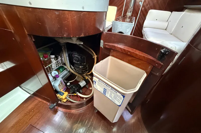 Slide: The Image of Interior of 1990 Beneteau First 35s5 yacht showing storage and waste bin. - 68