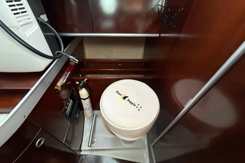 Slide: The Image of Interior of 1990 Beneteau First 35s5 yacht with fire extinguisher and equipment. - 73