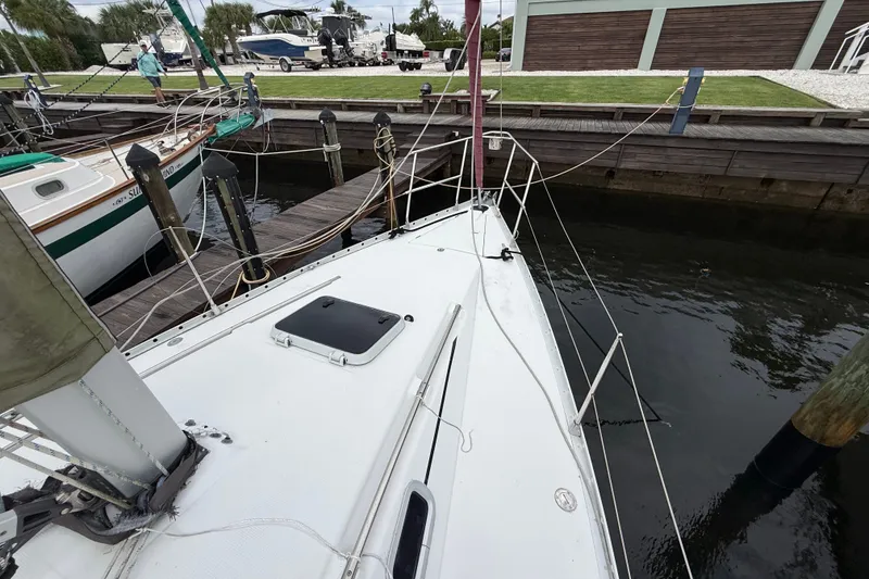 Slide: The Image of Beneteau First 35s5 sailboat docked at marina, 1990 model, view of deck and surroundings. - 29