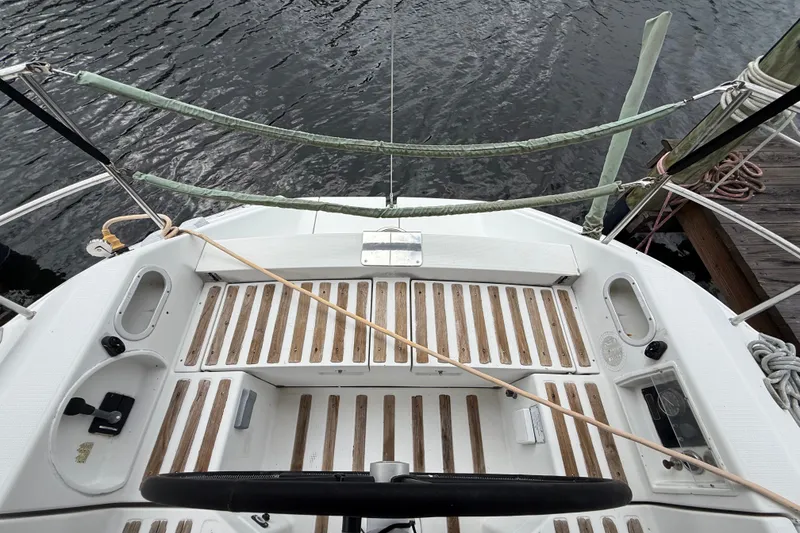 Slide: The Image of Cockpit view of 1990 Beneteau First 35s5 sailboat with wooden deck details. - 47