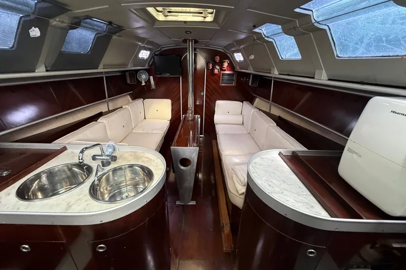 Slide: The Image of Interior of 1990 Beneteau First 35s5 yacht with modern amenities and elegant design. - 83