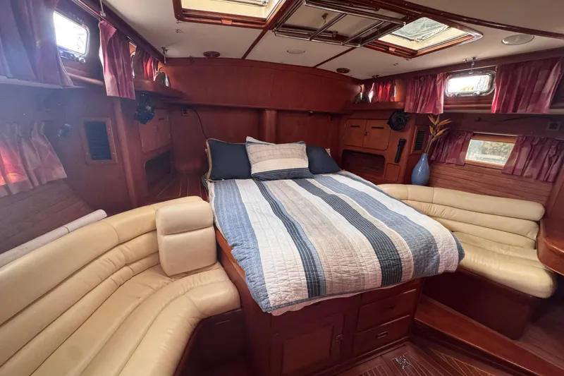Slide: The Image of Luxurious interior of 1989 Little Harbor Sloop 58' with cozy bed and seating area. - 86