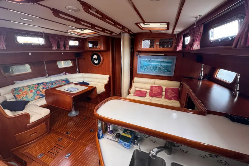 Slide: The Image of Luxurious 1989 Little Harbor Sloop 58' interior with elegant wood finish and cozy seating. - 48