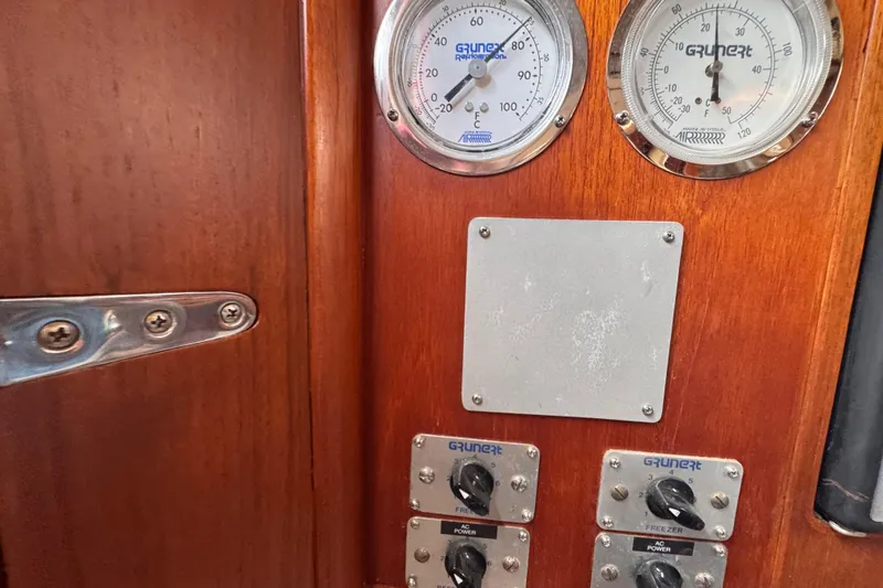Slide: The Image of Control panel on 1989 Little Harbor Sloop 58', featuring gauges and switches. - 62