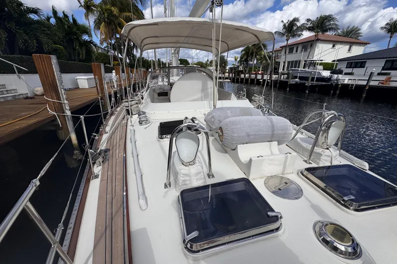 Slide: The Image of 1989 Little Harbor Sloop 58' docked, showcasing deck and cabin features. - 19