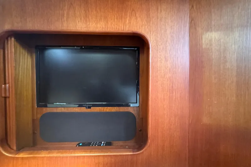 Slide: The Image of Built-in TV and speaker on 1989 Little Harbor Sloop 58' wooden interior. - 83