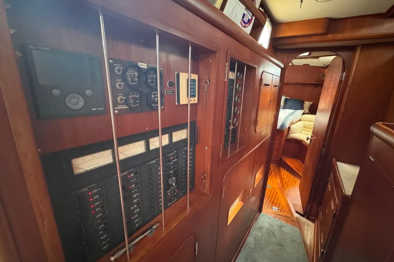Slide: The Image of Interior of 1989 Little Harbor Sloop 58' showing control panels and cozy cabin. - 67