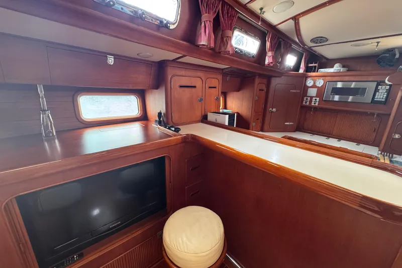 Slide: The Image of Interior of 1989 Little Harbor Sloop 58' with wood finish and modern amenities. - 56