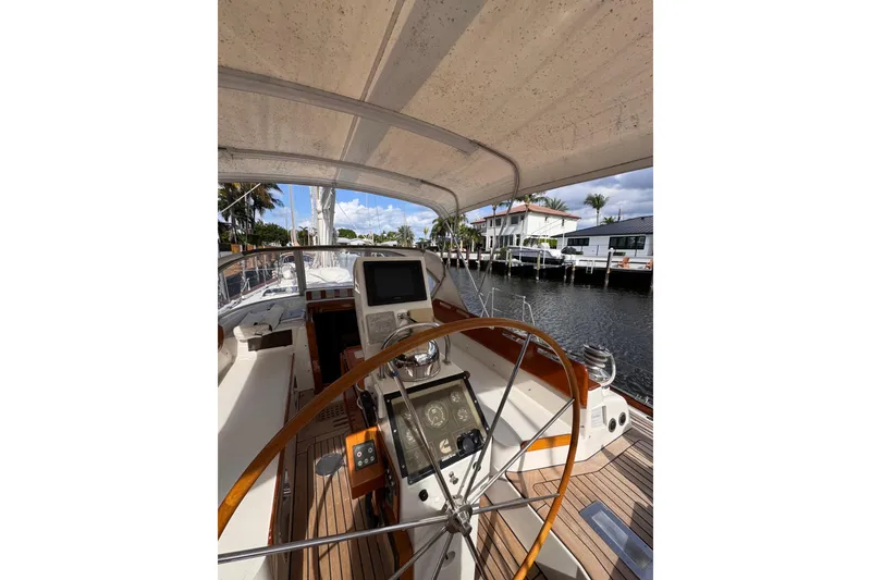 Slide: The Image of 1989 Little Harbor Sloop 58' cockpit with wooden wheel and navigation equipment. - 104