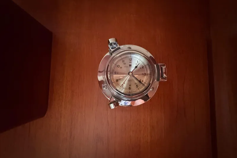 Slide: The Image of Chrome nautical clock on wooden panel, Little Harbor Sloop 58', 1989. - 80