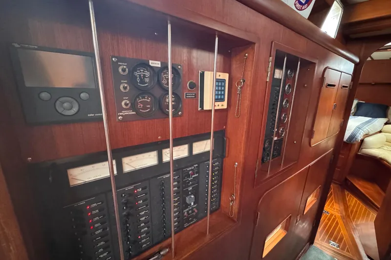 Slide: The Image of Control panel of 1989 Little Harbor Sloop 58' yacht, featuring gauges and switches. - 68
