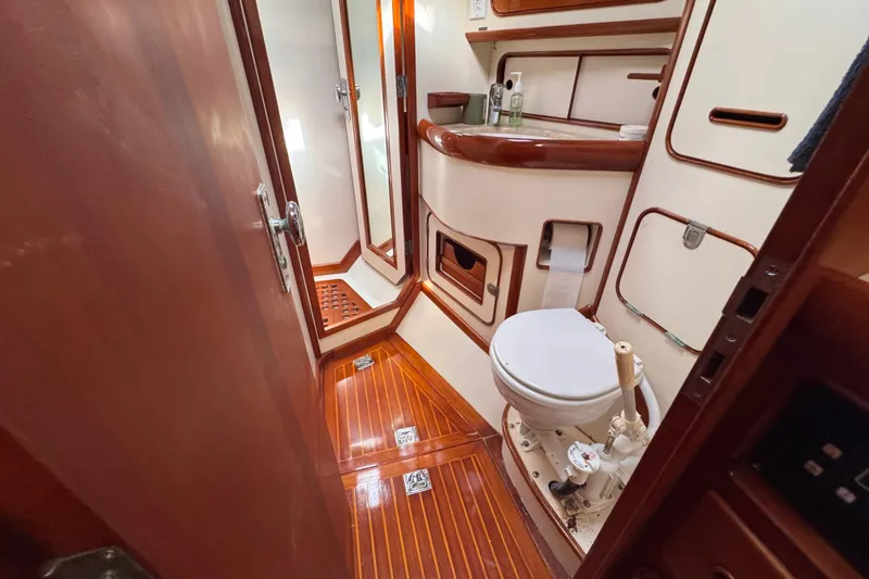 Slide: The Image of Luxurious 1989 Little Harbor Sloop 58' yacht bathroom with wooden accents and modern amenities. - 78