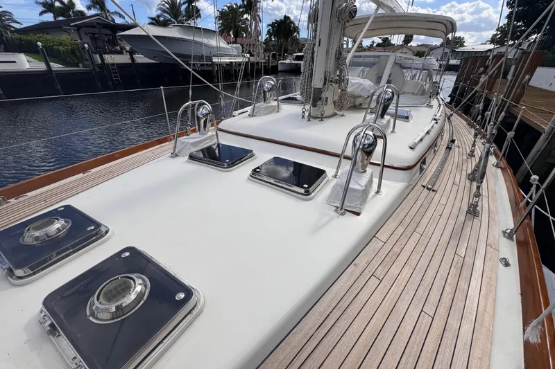 Slide: The Image of 1989 Little Harbor Sloop 58' yacht deck with sleek design and polished wood finish. - 41