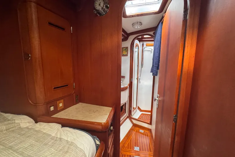 Slide: The Image of Interior of 1989 Little Harbor Sloop 58' with wood paneling and compact bathroom. - 74