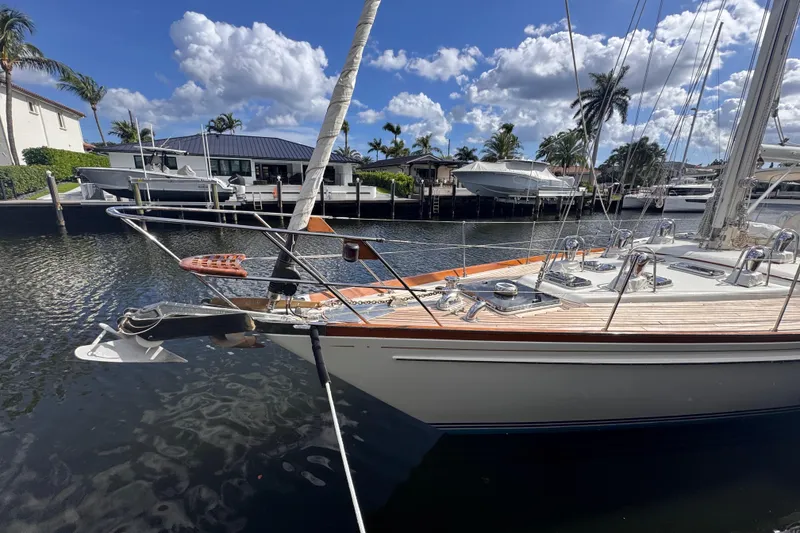 Slide: The Image of 1989 Little Harbor Sloop 58' docked, showcasing sleek design and polished deck. - 2