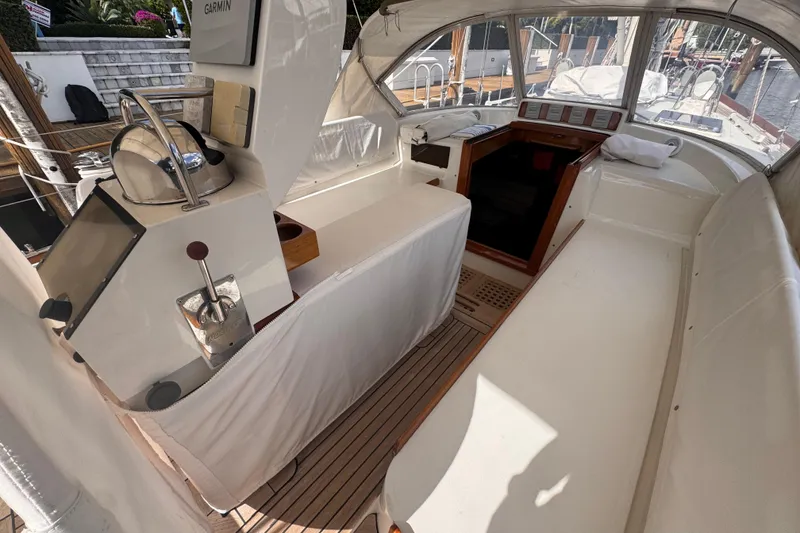Slide: The Image of 1989 Little Harbor Sloop 58' cockpit with helm, seating, and navigation equipment. - 23