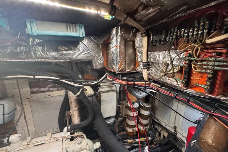 Slide: The Image of Engine room of 1989 Little Harbor Sloop 58' with wiring and components. - 96