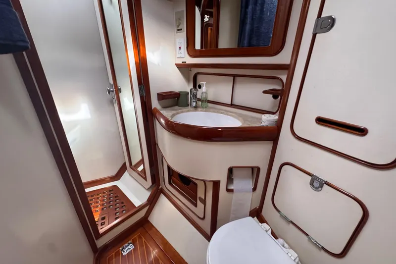 Slide: The Image of Luxurious 1989 Little Harbor Sloop 58' bathroom with elegant wood accents and modern amenities. - 79