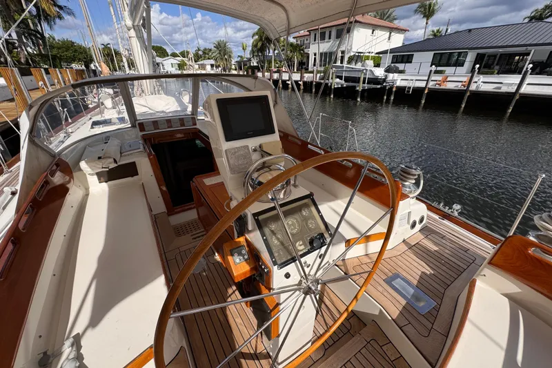 Slide: The Image of Cockpit of 1989 Little Harbor Sloop 58' with wooden wheel and navigation instruments. - 101