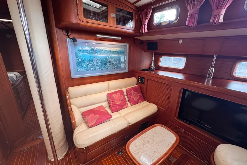 Slide: The Image of Luxurious 1989 Little Harbor Sloop 58' interior with cozy seating and elegant wood finishes. - 51