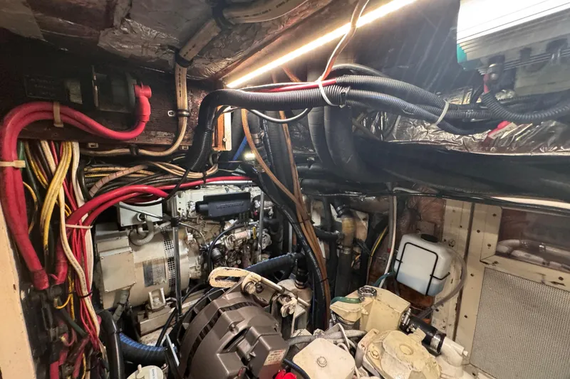 Slide: The Image of Engine room of 1989 Little Harbor Sloop 58' with wiring and machinery. - 97