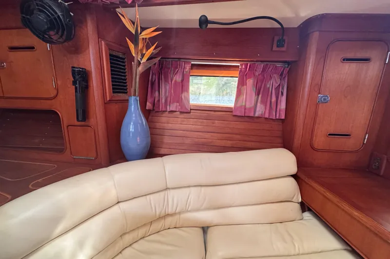 Slide: The Image of Interior of 1989 Little Harbor Sloop with leather seating and wooden cabinetry. - 88