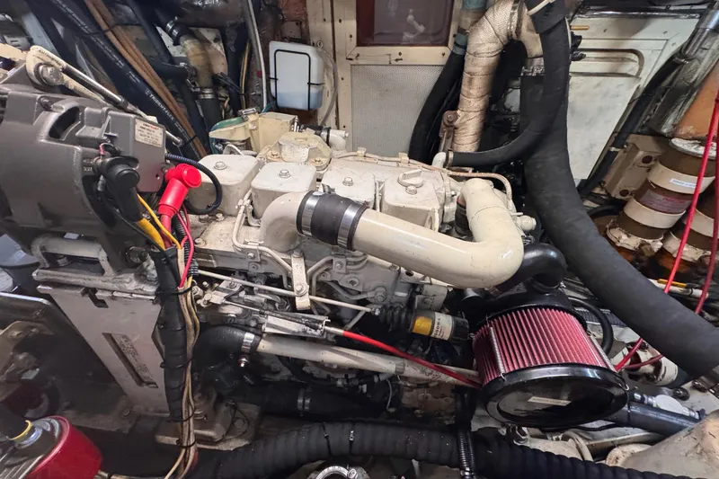 Slide: The Image of Engine room of a 1989 Little Harbor Sloop 58' with visible components and wiring. - 94